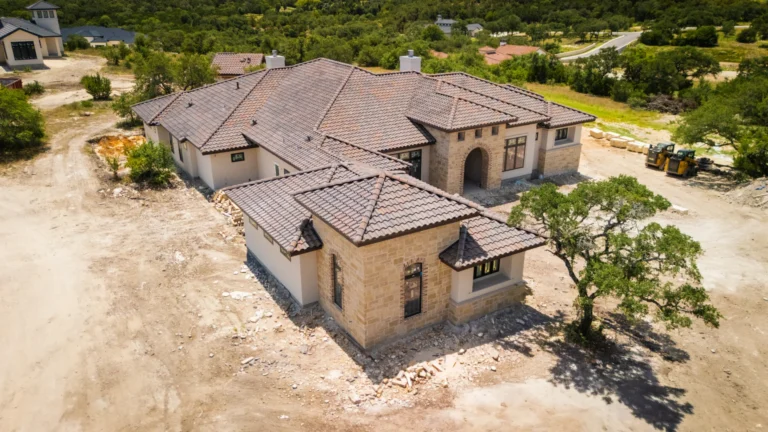 Exterior aerial photo of a custom modern tuscan estate by Genesis Custom Homes in Pecan Springs, Boerne, TX