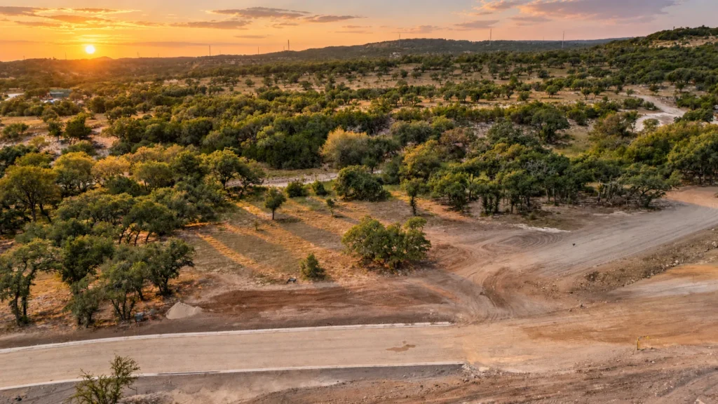 Sunset over oak-covered hills from Lot 36, a 1.09-acre Texas Hill Country homesite